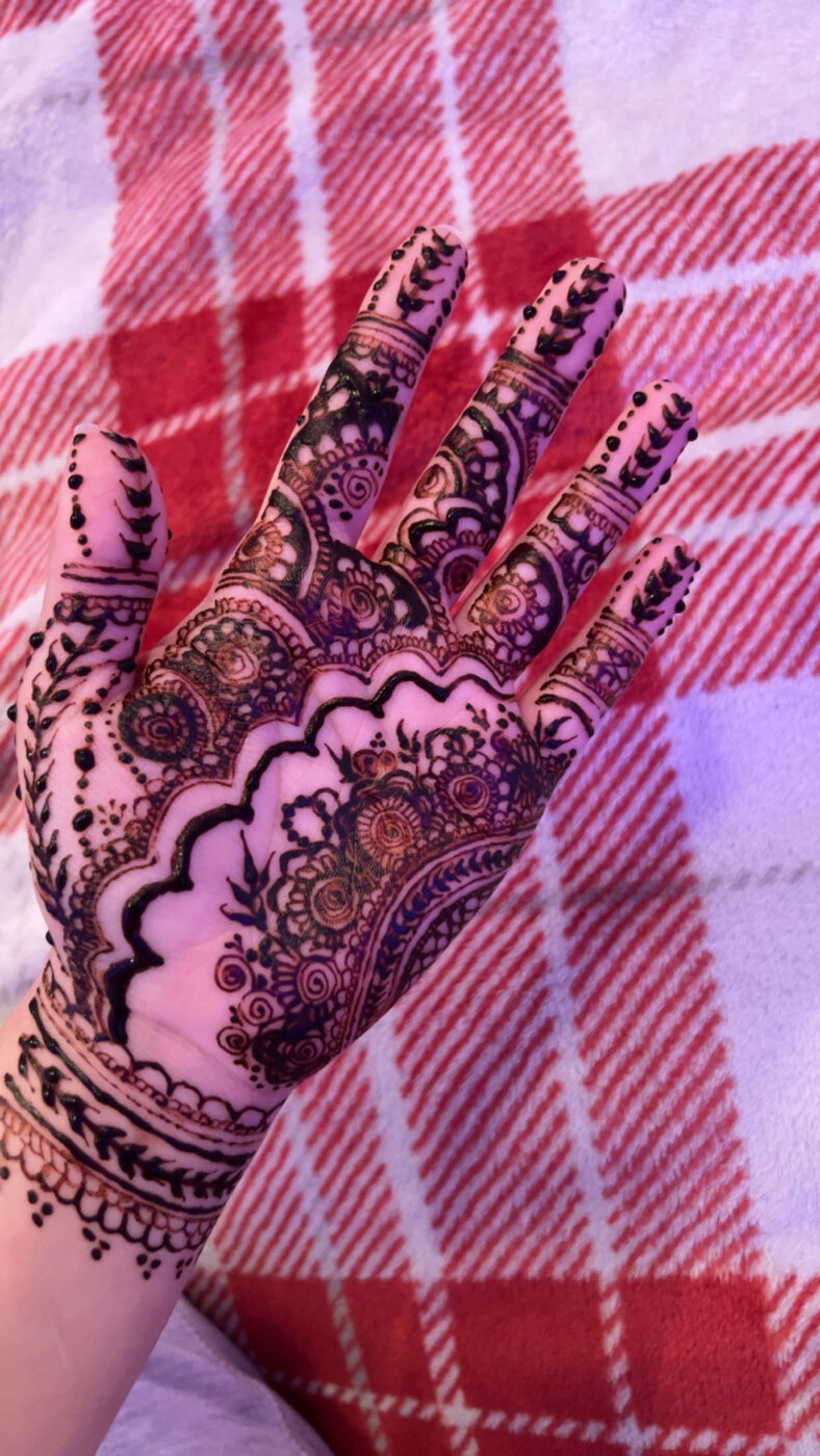 Intricate palm henna